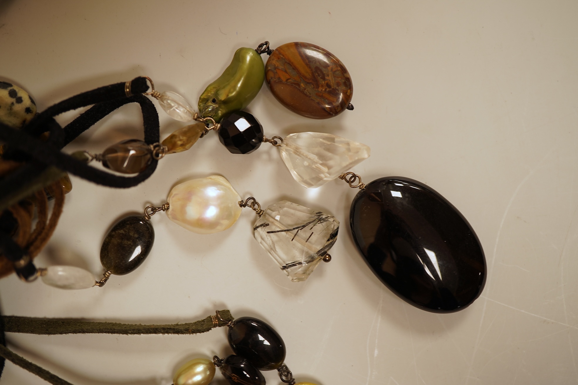 A collection of cultured pearls and hardstone jewellery, comprising: a cultured pearl necklace with a cultured pearl and diamond clasp in 18ct gold, length 46cm, British hallmarks; a cultured pearl necklace with a gold b